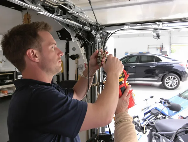 North Royalton Garage Door Repair safety certified technician performing cable replacement in North Royalton