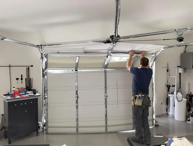 North Royalton Garage Door Repair specialist performing precise section replacement on North Royalton garage door